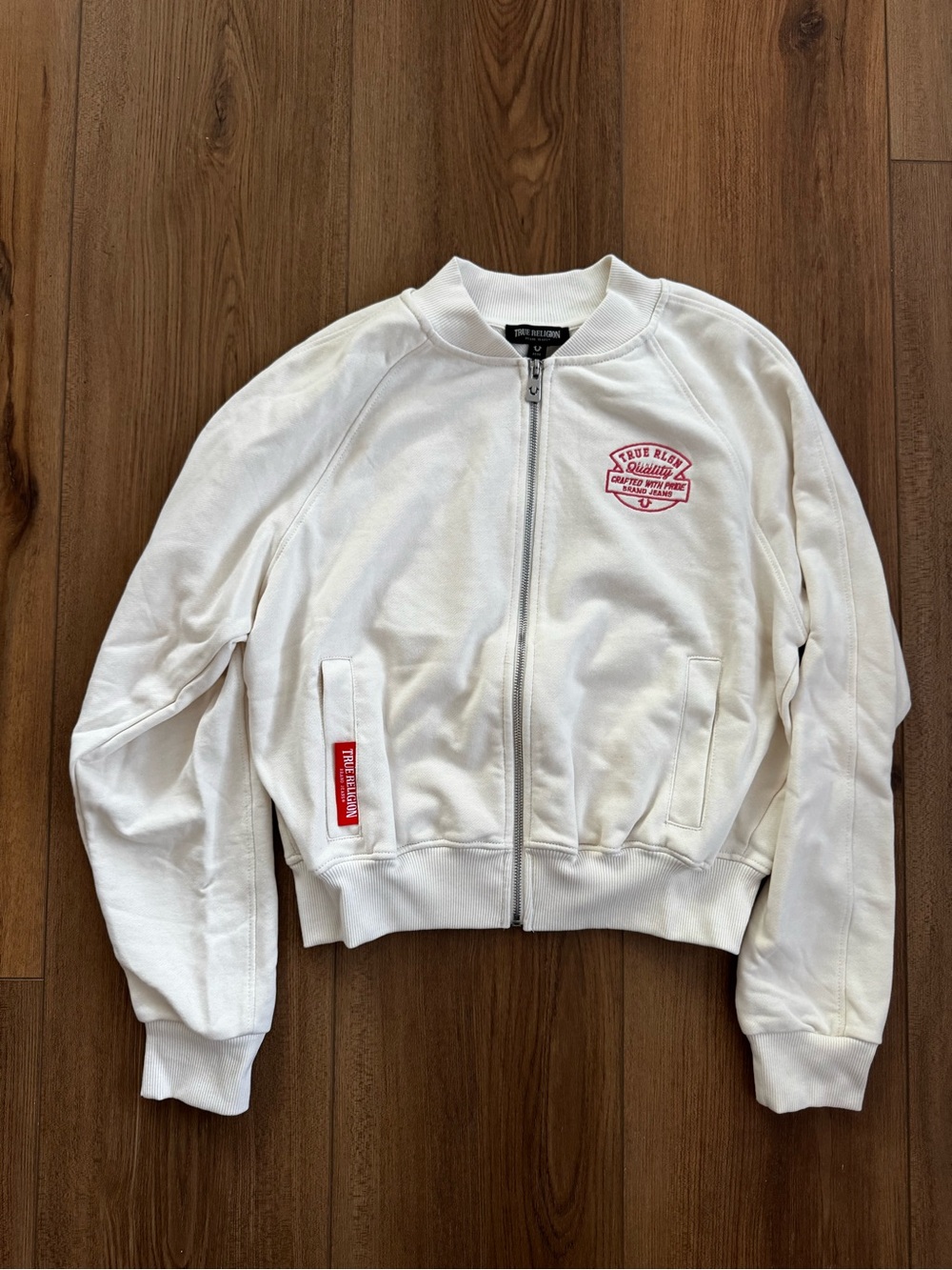 True Religion White Bomber Jacket with Red Logo Patch